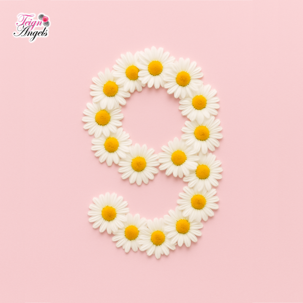 A number 9 made up of daisies, on a pale pink background. In the top left corner is 'Teign' in dark pink and 'Angels' in black, with two dark daisies and one pink daisy.