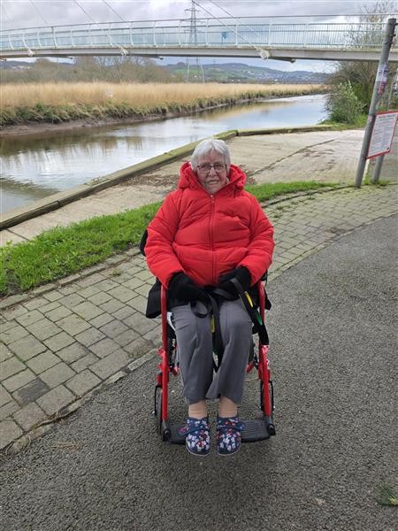 Kath, a person we support, in her wheelchair